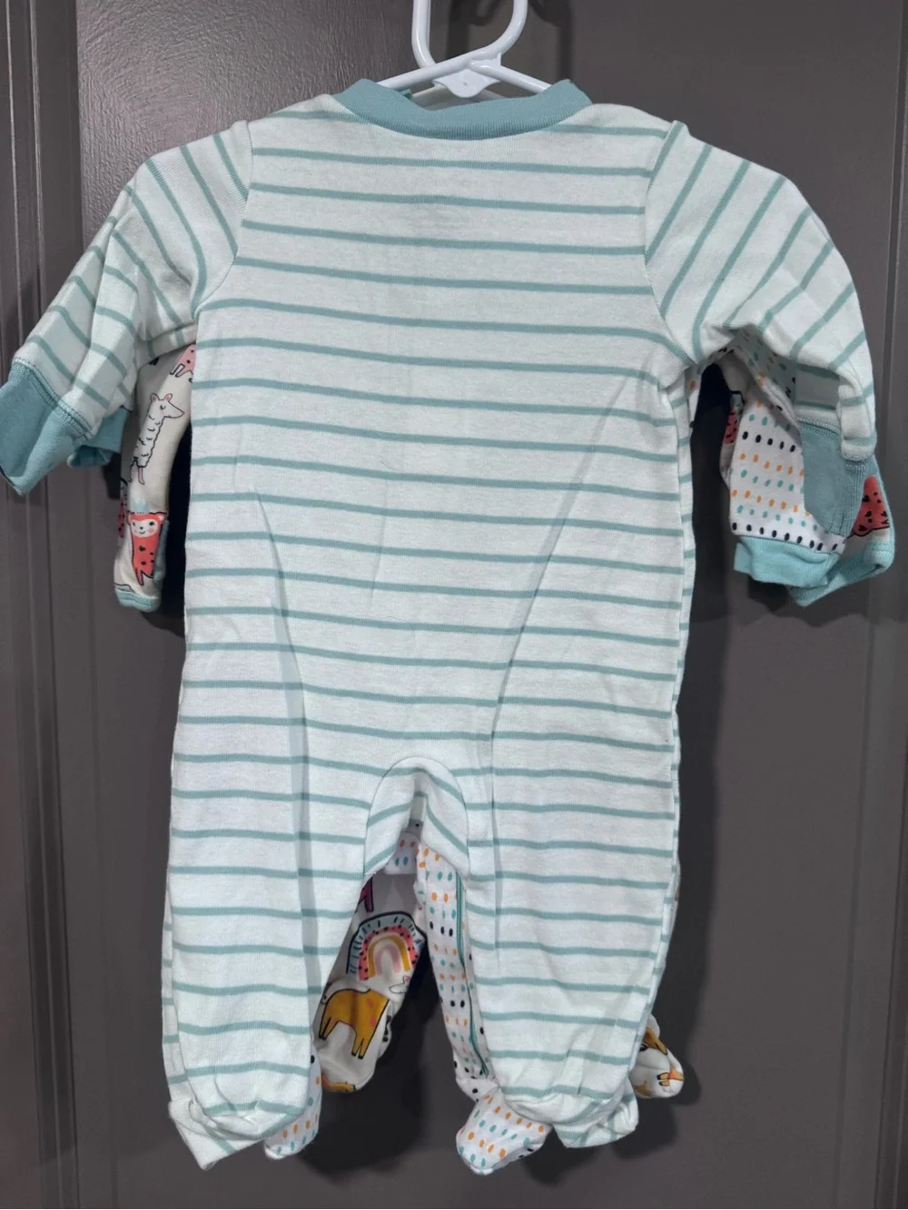 Three piece lot of light weight footed Pajamas, gender neutral.